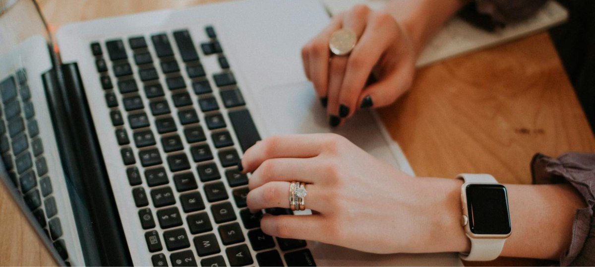 Marketer typing short-form marketing copy generated with Copy.ai templates