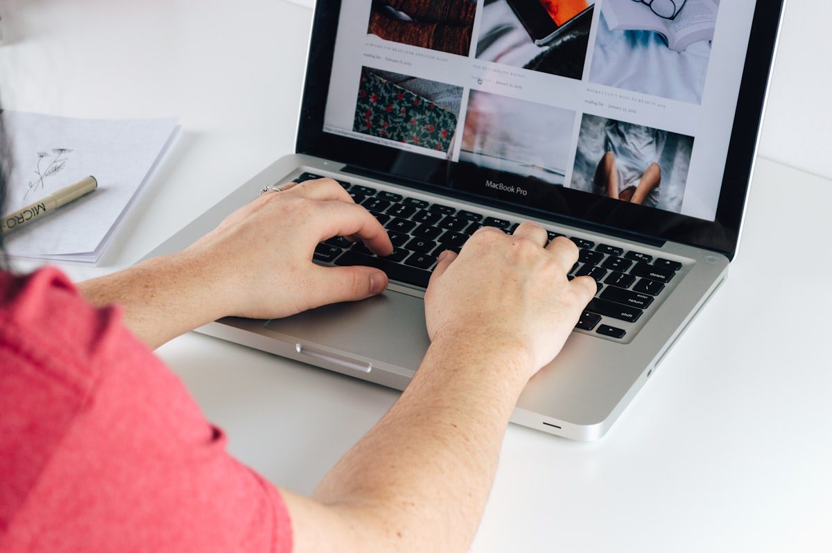Blogger typing on a laptop, illustrating why Notion AI is a perfect tool for bloggers